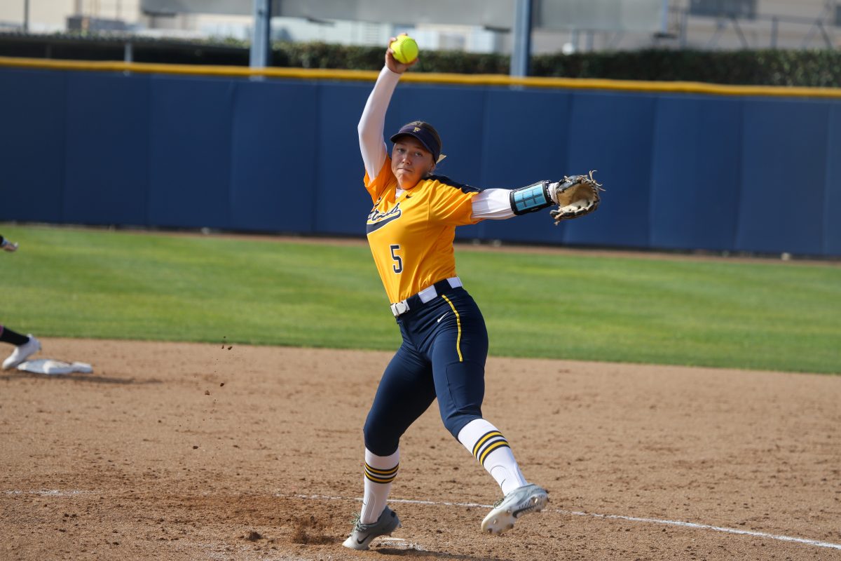 Fullerton freshman pitcher Macy Brandl steps in the circle in the second inning and faced big moments in the game in an 8-6 win over Long Beach City College on Feb. 16, 2024. 