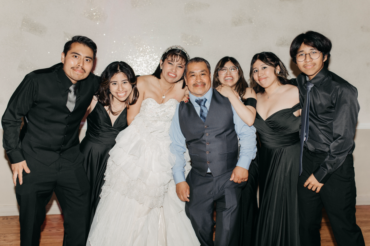 The Cruz family celebrated Gaby Monroy and Jose Cruz Sr.'s (middle) second wedding on July 8, 2023. Jose Cruz Jr., Maria Cruz, Madison Cruz, Loren Cruz, and John Cruz (left to right in black) were happy to see their parents renew their vows and celebrate 25 years of marriage.