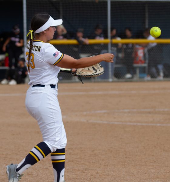 Hornet freshman first baseman Veronica Moore throws the ball around the infield at home against Santa Ana College on Tuesday, April 24, 2024.