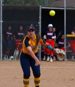Hornets freshman first baseman Veronica Moore makes a charging play on the ball and flips it back to first base to get the out on Thursday, April 4, 2024. 