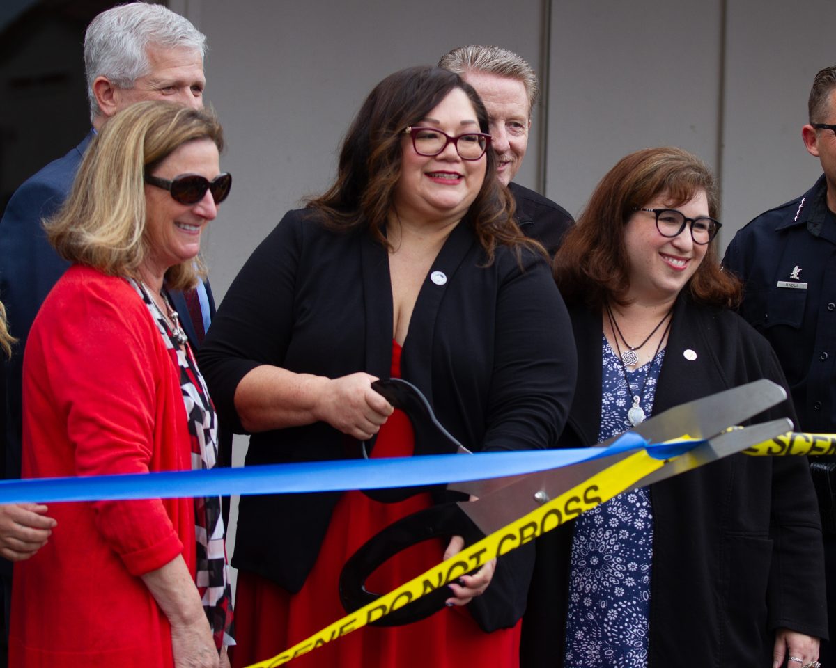 Fullerton College president Dr. Cynthia Olivio cuts the ribbon with Shana Charles and Sharon Quirk Silva during the Crime Lab opening ceremony on Friday, May 17.