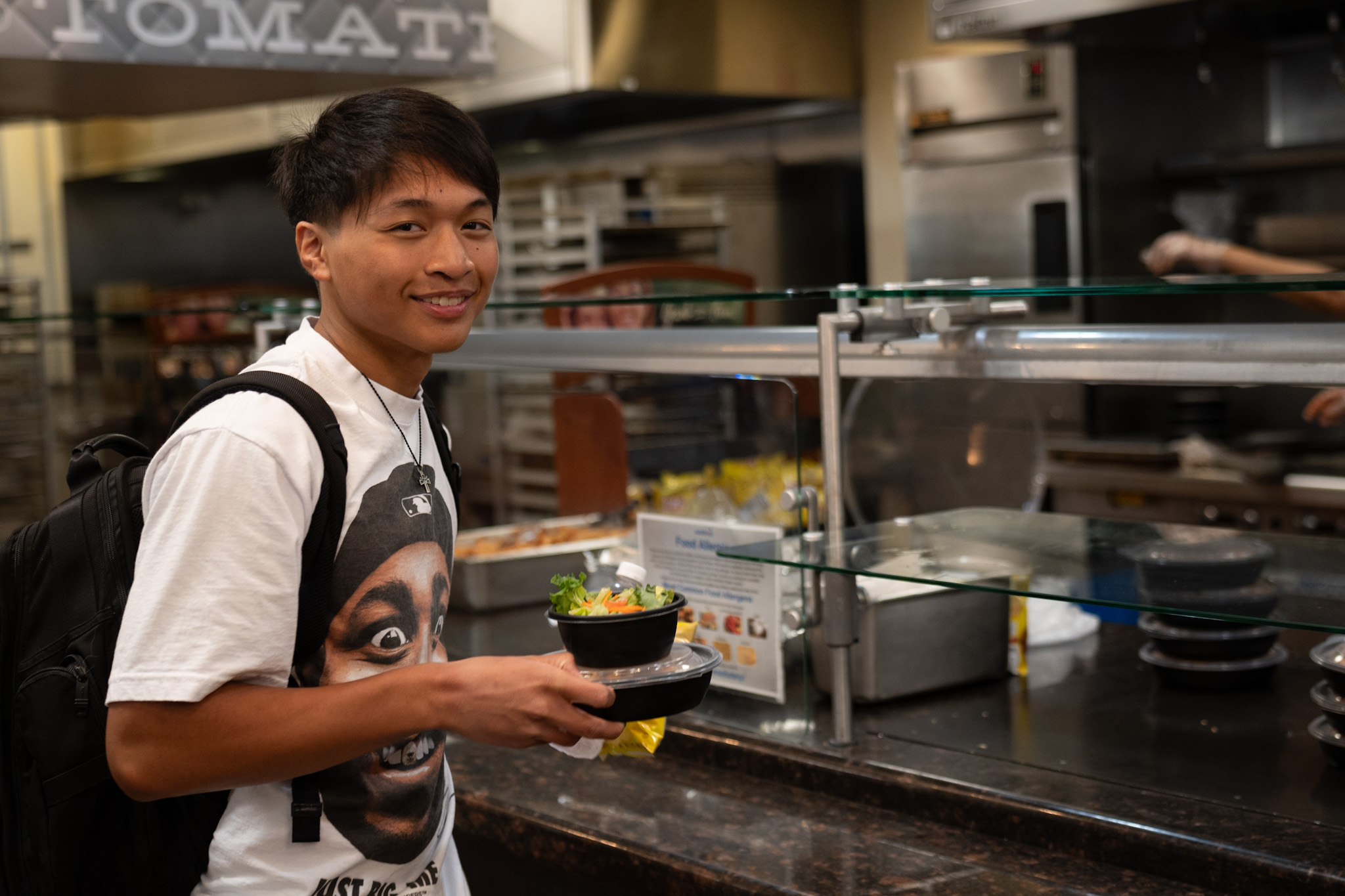 First year student Ben Villa receives his free meal provided by the school on Monday, August 26, 2024.