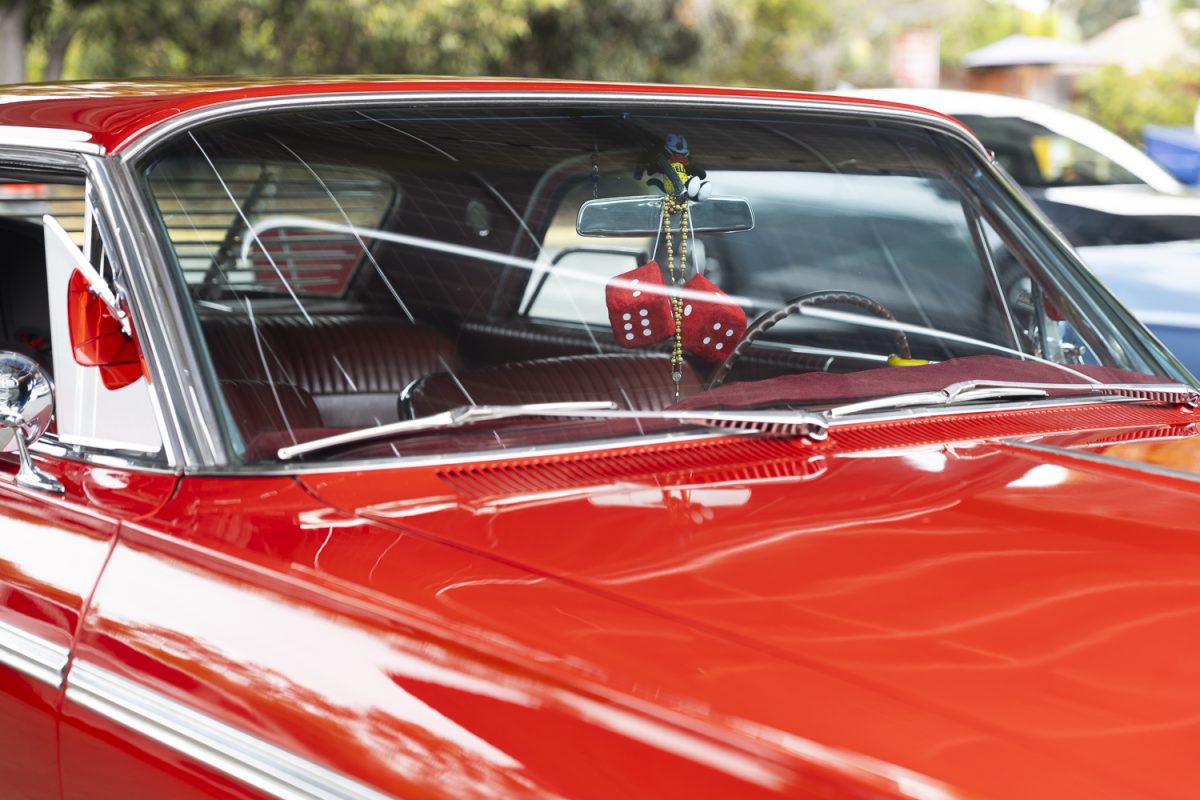 Red Chevrolet Impala was on display witht the matching dice at the 2nd Annual Cruisin' to College Car Show on September 14, 2024.