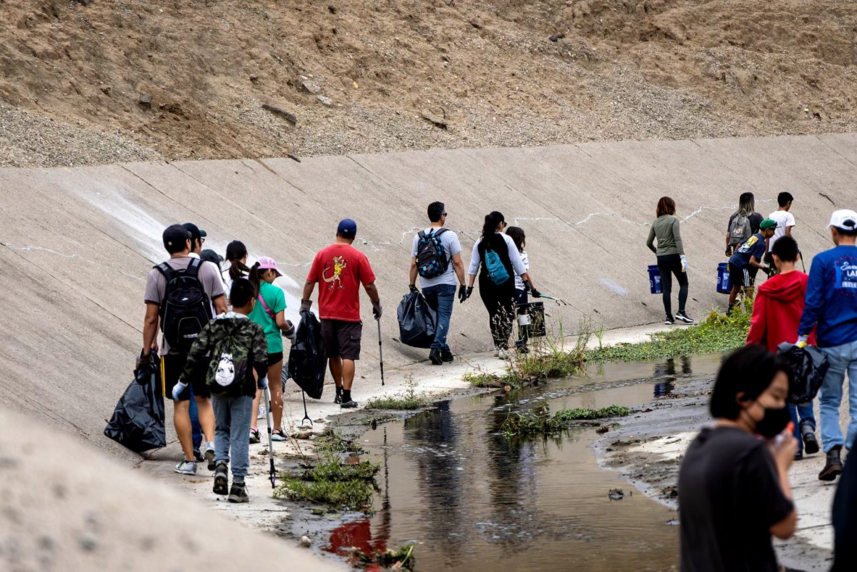 Volunteers make their to way towards the Fullerton Channel Clean Up On Sept. 21, 2024. 