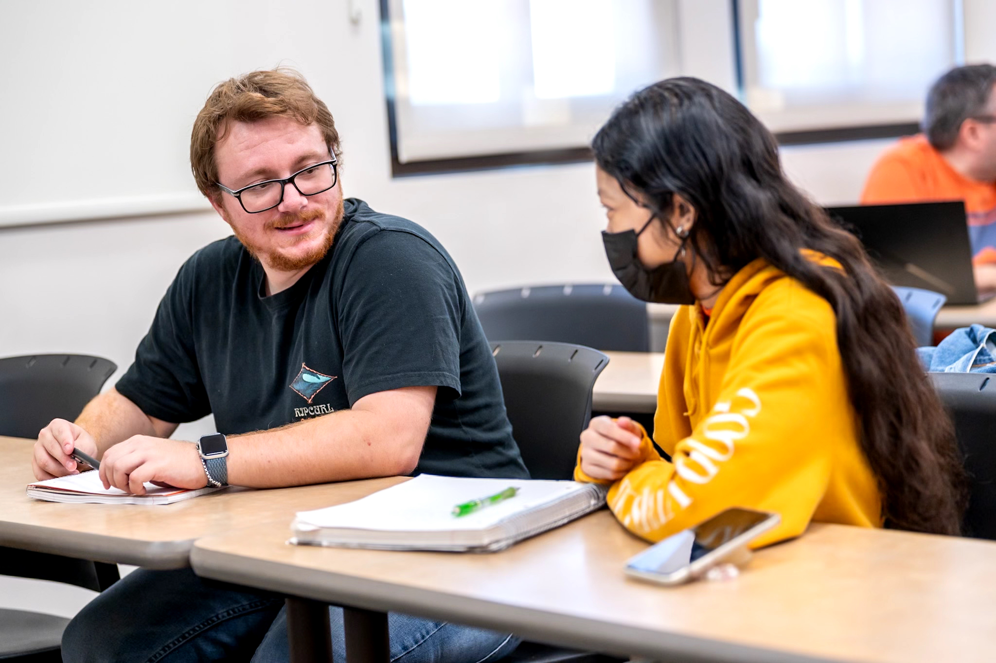 Fourth-year student Dylan Darrow And sophomore student Monica Son, discuss professor Noguera's lecture during their American ethnic studies class on Tuesday Sept. 10, 2024. 