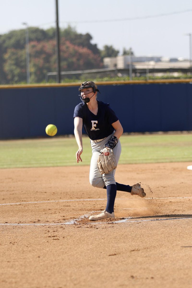 Starting pitcher Grace Workman winds up and pitches the ball looking for a strikeout.