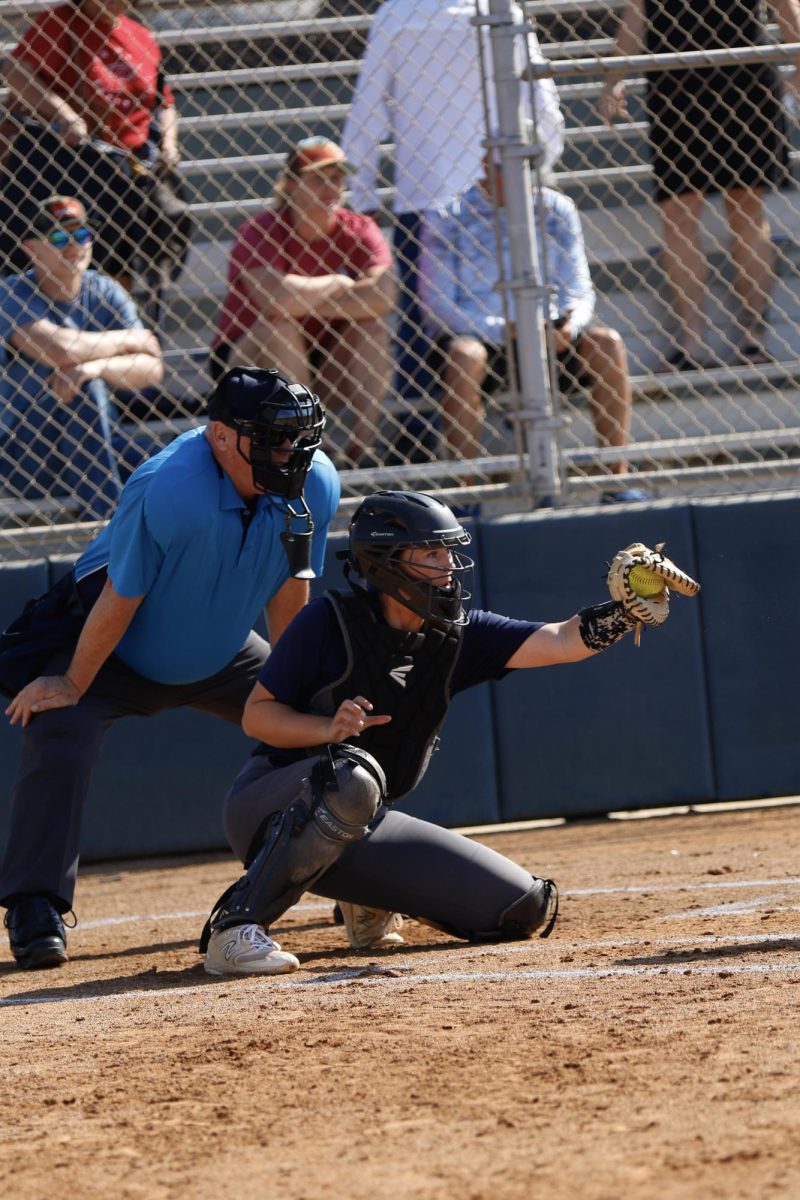 Catcher Avery Wiersma frames the pitch behind the plate landing for a strike.