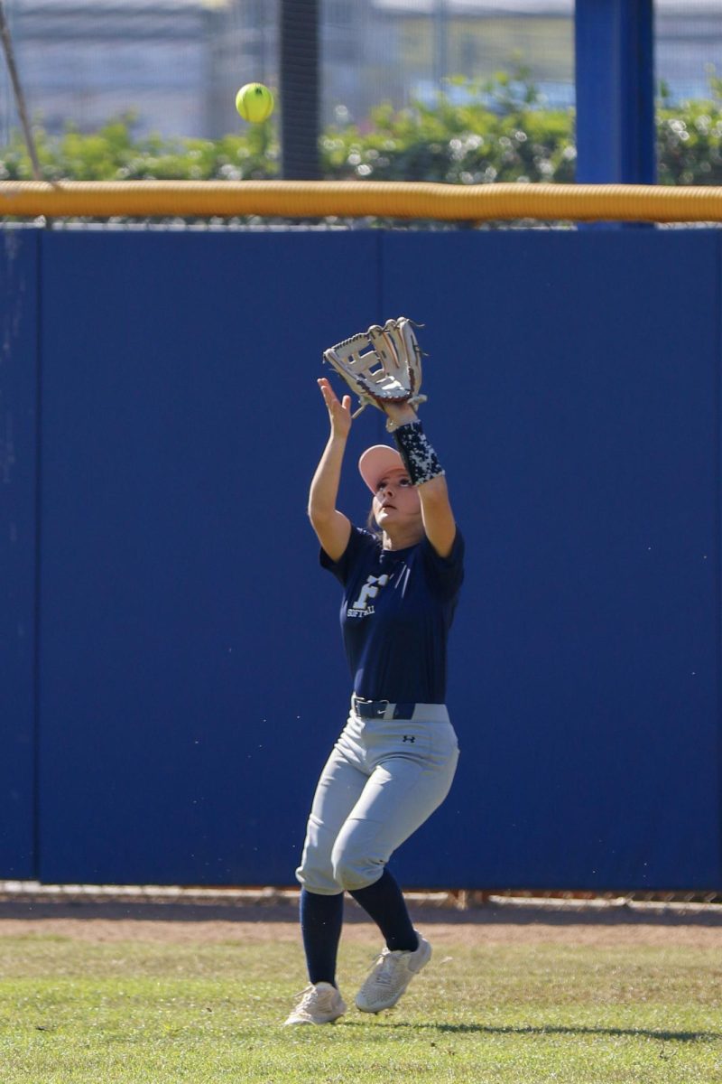 Center Fielder Savannah Patino positions herself under the ball ready for a catch.