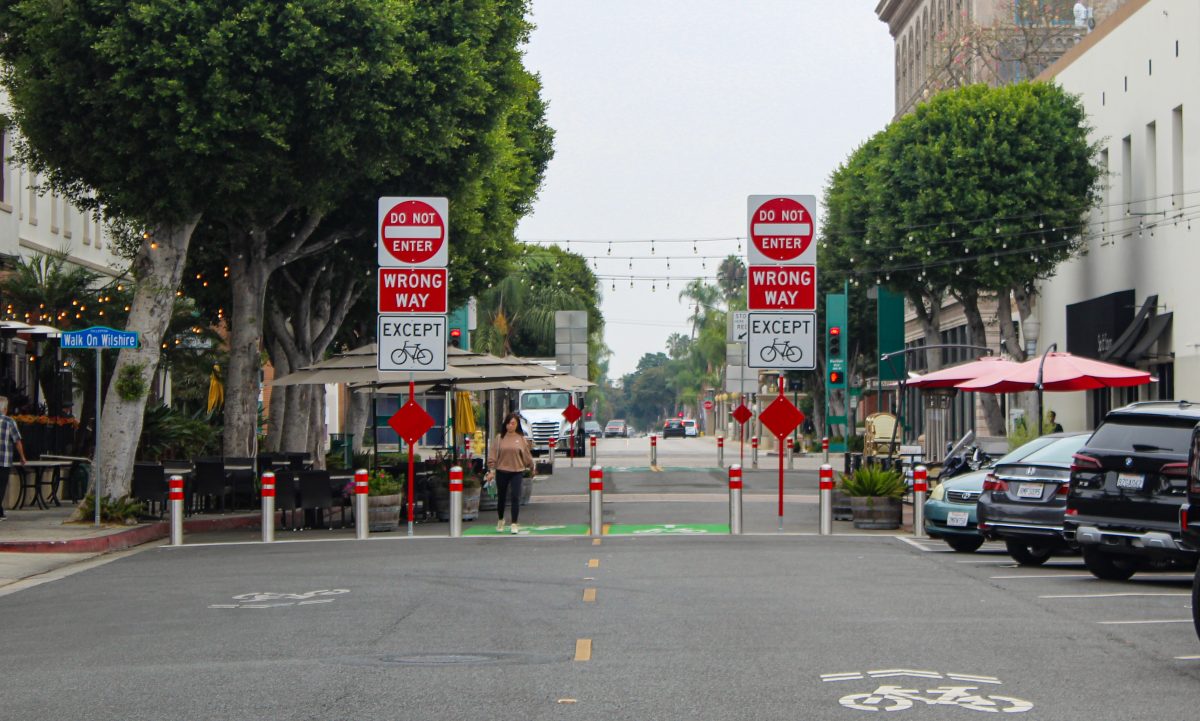 The city of Fullerton has added numerous safety measures, including blockades and large street signs, to protect Walk on Wilshire from traffic flow.