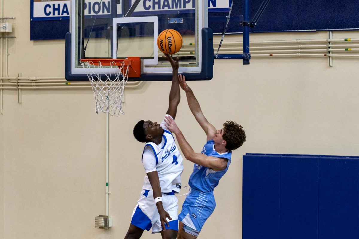 Guard Justin Davis blocks Justin Rener on Saturday, Nov. 16, 2024.