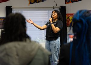 Milani Smith gives the opening speech for the Welcome Black Celebration at the Umoja Village on Feb. 4.