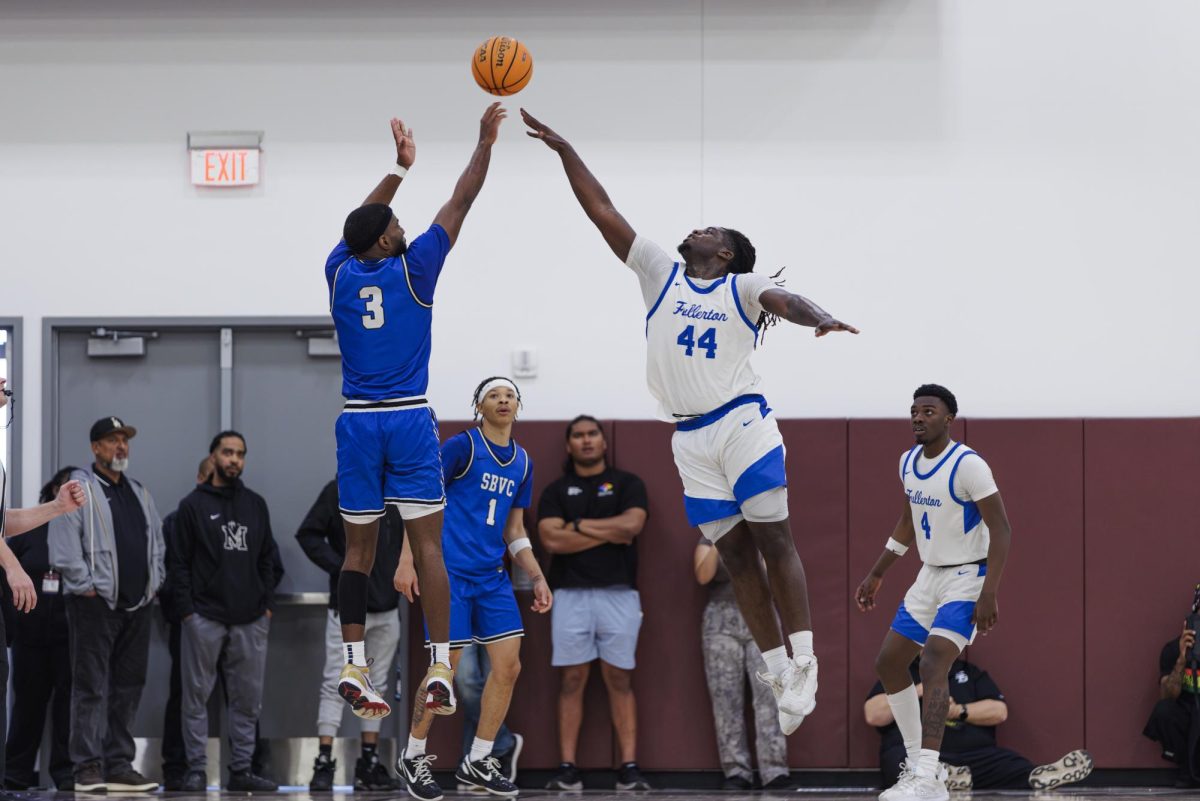 Darvelle Wyatt goes up for the block to deny Khemanni Davis of a 3-pointer in the semi-final game of the 3C2A State Tournament in Mt. San Antonio College Walnut, Calif. on Saturday, March 15, 2025