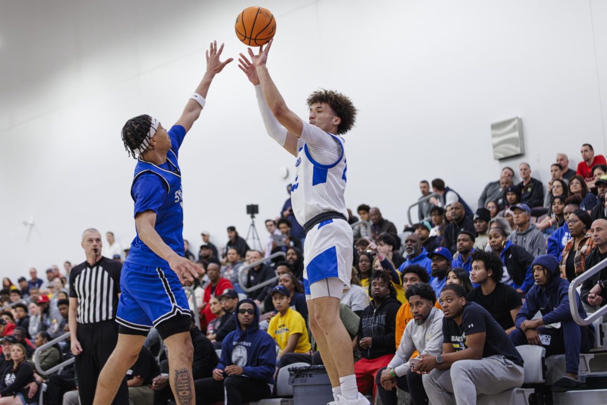Addy G'Bye shoots a 3-pointer as the San Bernardino Valley College defender tries to deny him the score in the semi-final game of the 3C2A State Tournament in Mt. San Antonio College Walnut, Calif. on Saturday, March 15, 2025