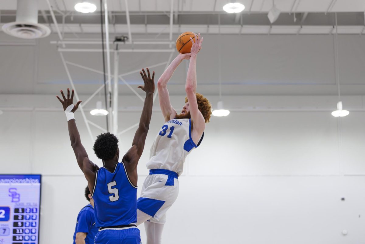 Joe Grahovac shoots a 2-pointer in the paint over Jason Hilliard in the semi-final game of the 3C2A State Tournament in Mt. San Antonio College Walnut, Calif. on Saturday, March 15, 2025