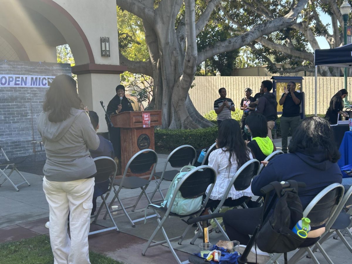 Bayyinah Salahuddin "Peacock Secrets Poetry" performs spoken word at the Beat Cafe Open Mic at the Cruz Reynoso Courtyard on Feb. 26, 2025.