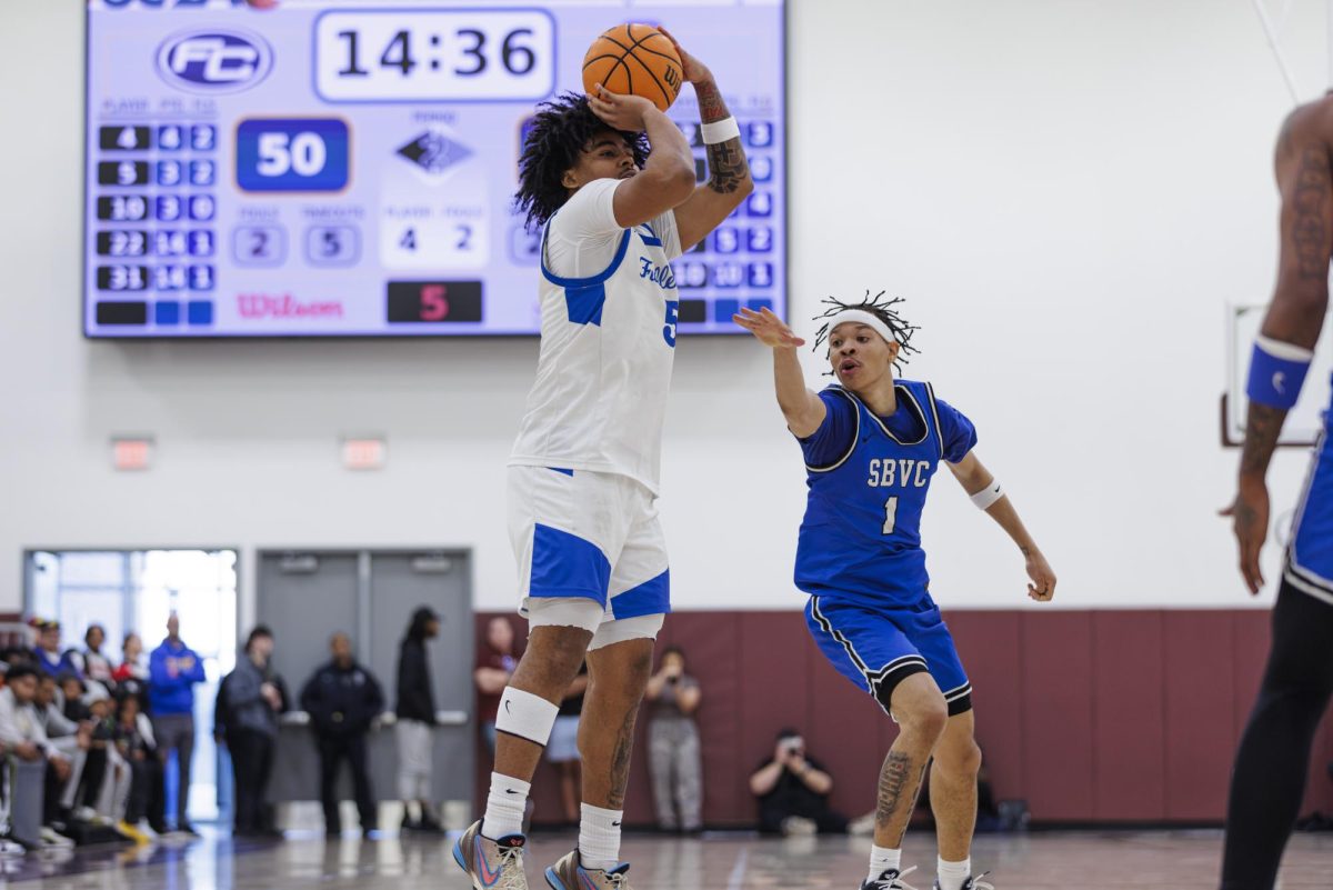 Jaqari Miles attempts to shoot a 3-pointer as Jason Lee tries to reach him in the semi-final game of the 3C2A State Tournament in Mt. San Antonio College Walnut, Calif. on Saturday, March 15, 2025