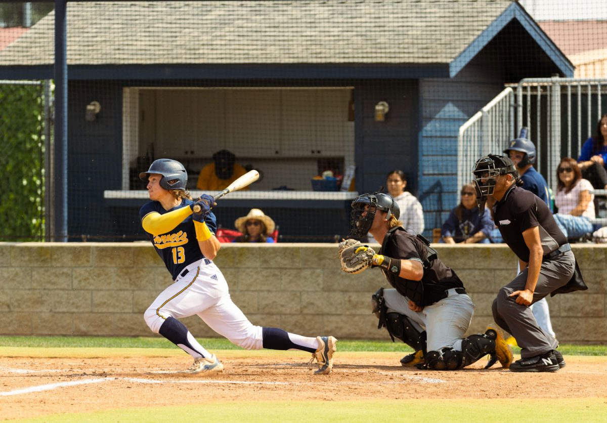Nate Pone hits a ball into play in Tuesday's home game against Golden West in Fullerton, Calif. on April 15, 2025.