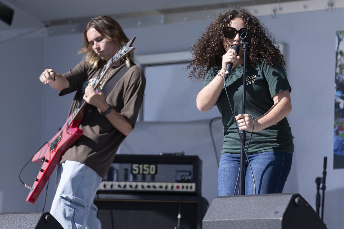 Lead singer for Chicken Nuggets on a 2sday, Emily Kashou, performs alongside support guitarist Matthew Craig at the Cypress Community Festival 2025.