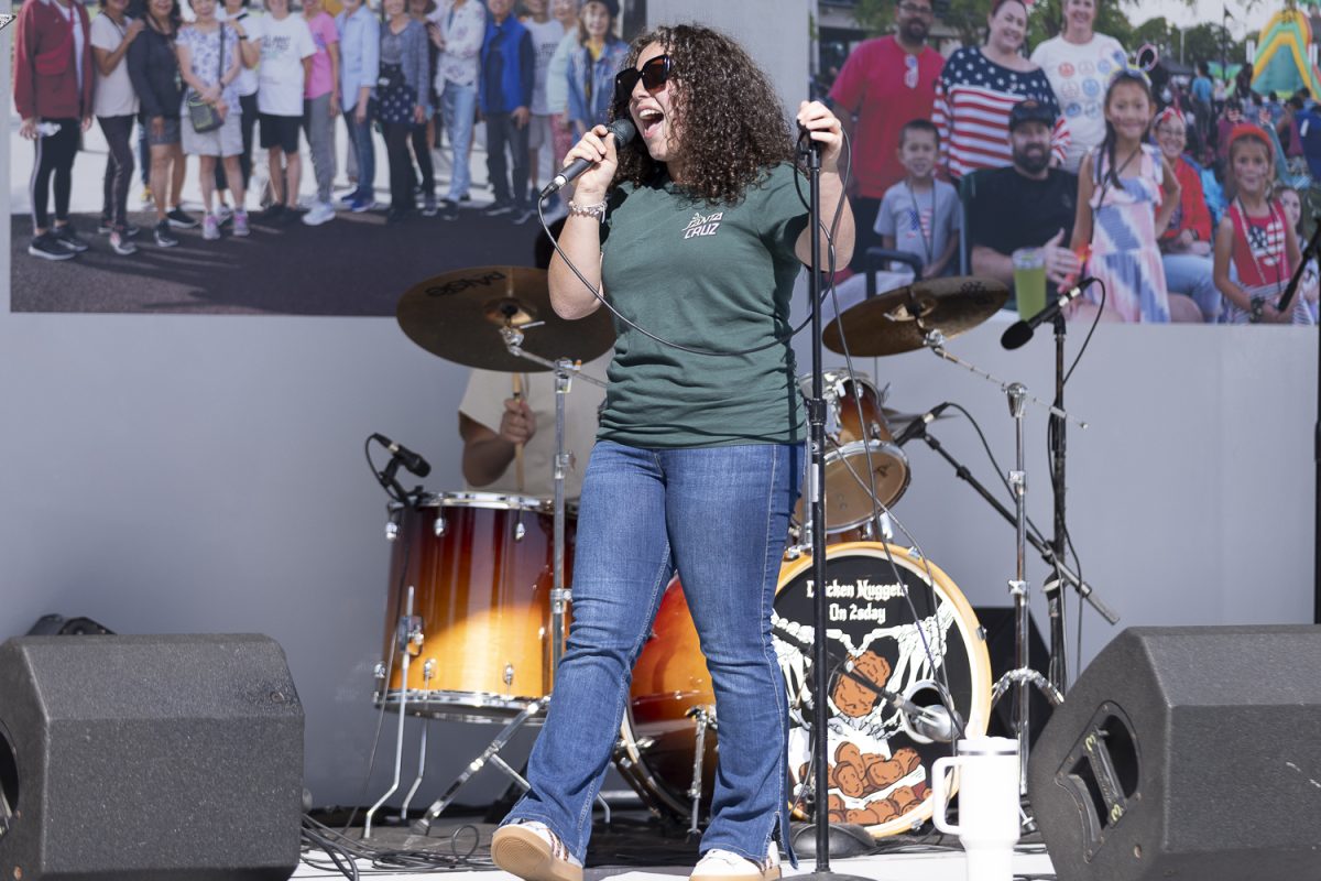 Lead singer for Chicken Nuggets on a 2sday, Emily Kashou, performs at the Cypress Festival 2025.