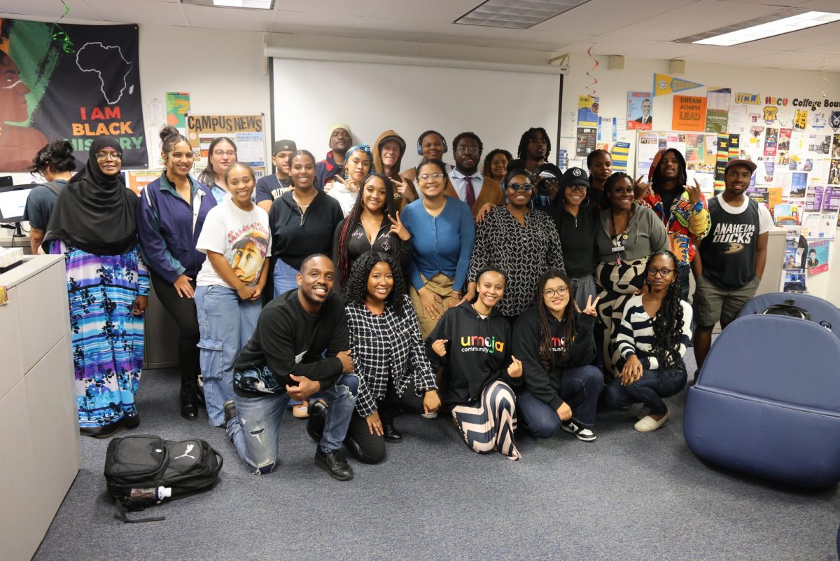 Umoja students pose for a group photo during the Friendsgiving event on Nov. 17, 2025.