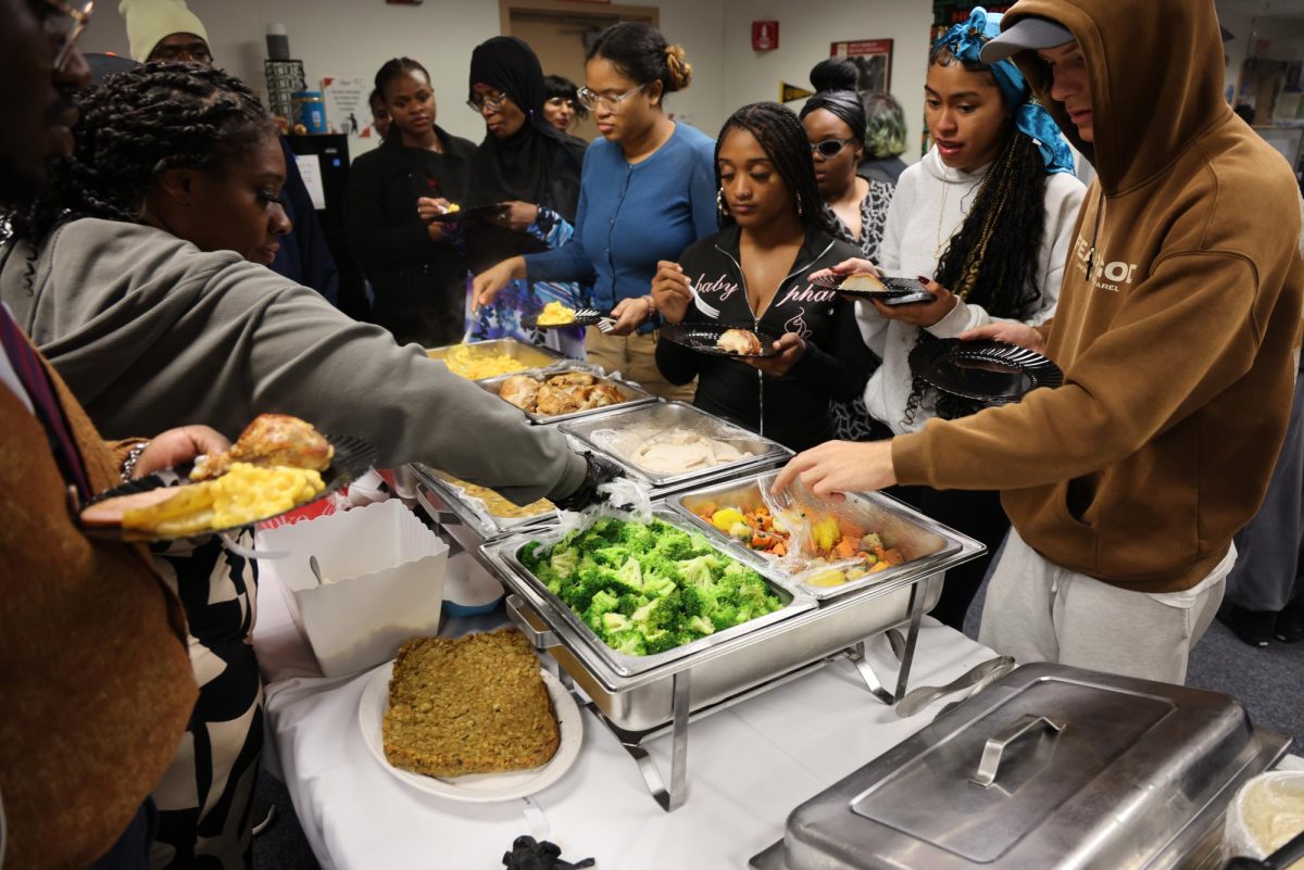 Umoja students dig into the buffet-style foods at Umoja's Friendsgiving & Wellness Workshop on Nov. 17, 2025.