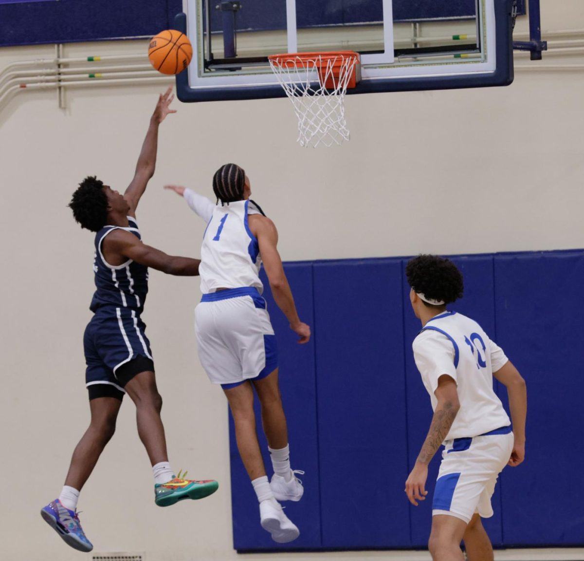 Citrus Owls point guard Amiri Meadows takes a shot as Fullerton Hornets Yoda Oke attempts to block him.