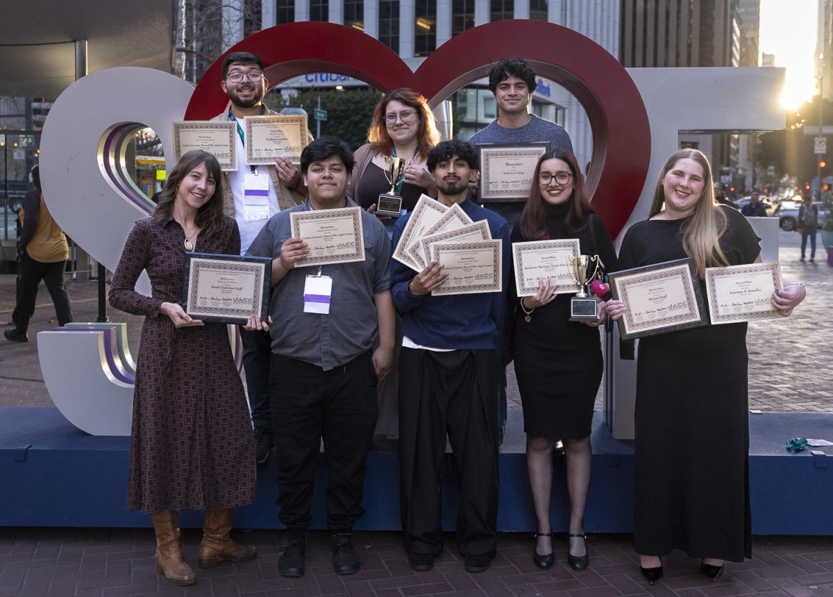The Hornet and Inside Fullerton editorial staff and Adviser Jessica Langlois pose in front of a Love SF sign with some of the awards that were given to the publications at the Associated Collegiate Press National College Media Conference in San Francisco on March 7, 2026.