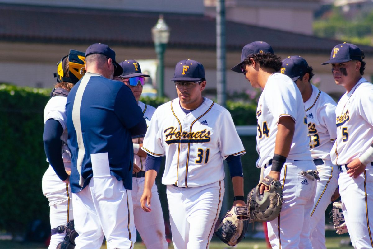 Fullerton starting pitcher Eddie Garcia walks off the mound after being taken out of the game against Santa Ana on March 26, 2026 in Fullerton, Calif.