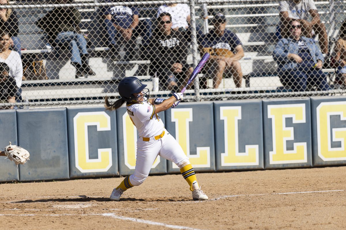 Fullerton's Zoey Bautista sends a fly ball into center field against Cypress on March 10, 2026, at Hornet Softball Field in Fullerton, Calif.
