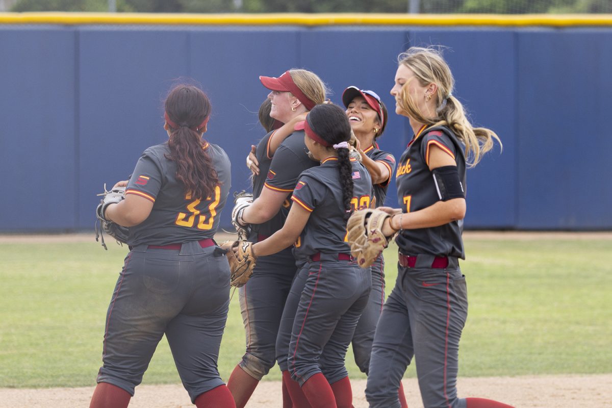 Saddleback players hug each other, after celebrating an emotional 8-7 victory over Fullerton on April 9, 2026, at Hornet Softball Field in Fullerton, Calif.
