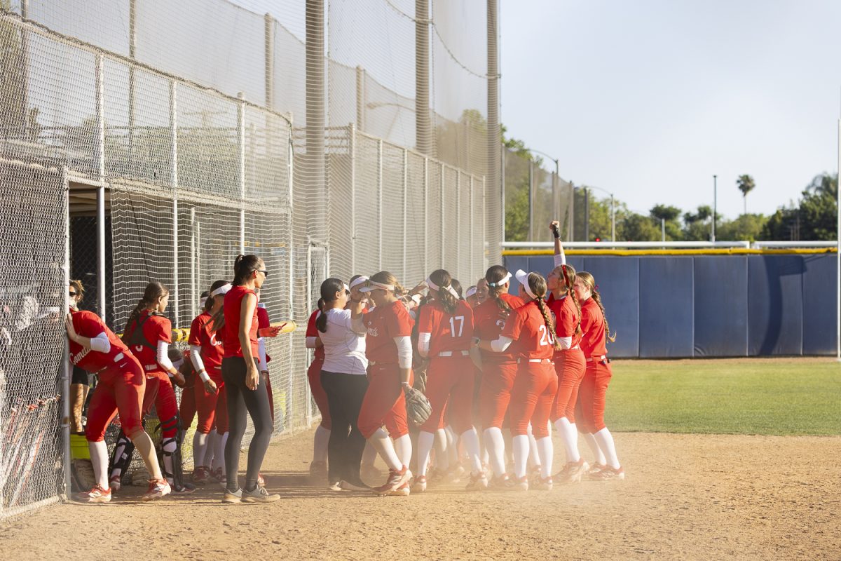 Palomar College players gather in a victory huddle after defeating Fullerton on April 8, 2026, at Hornet Softball Field in Fullerton, Calif.