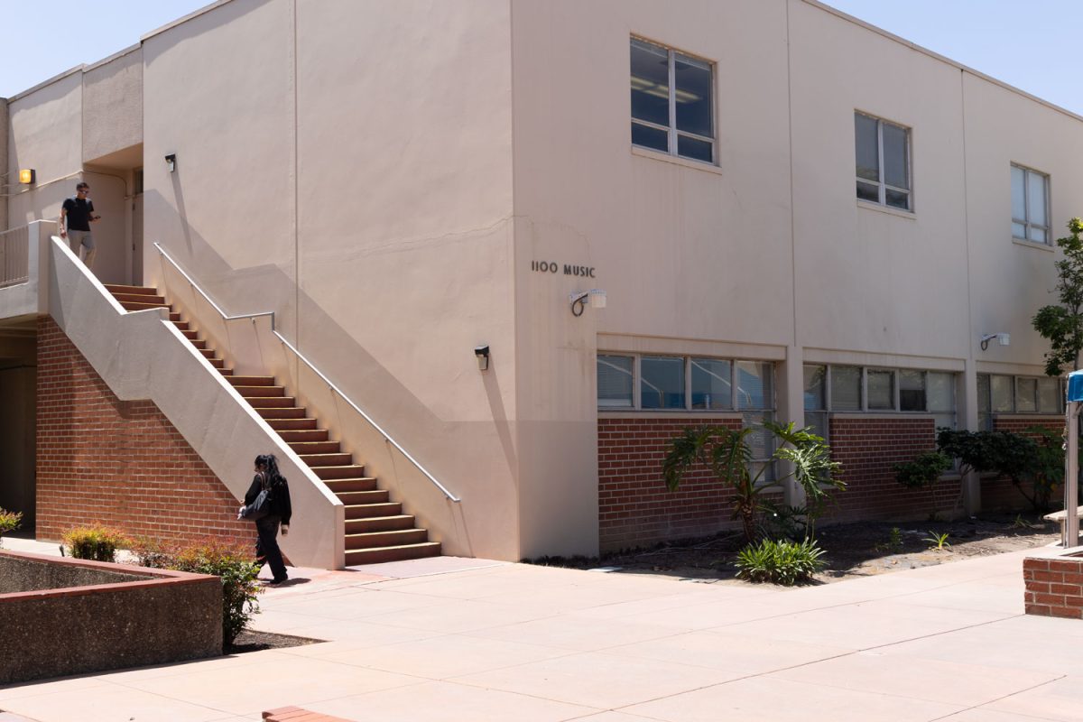 Students walk past the music building on Fullerton College campus in Fullerton, Calif., on Wednesday, April 29, 2026.  A deceased bat with rabies was found on the stairs outside the building on Friday, April 17, 2026.   