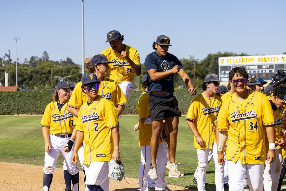Fullerton College players celebrate after defeating LA Pierce College 7–3 in Game 3 of the super regionals on May 9, 2026, at Hornet Baseball Field in Fullerton, Calif.