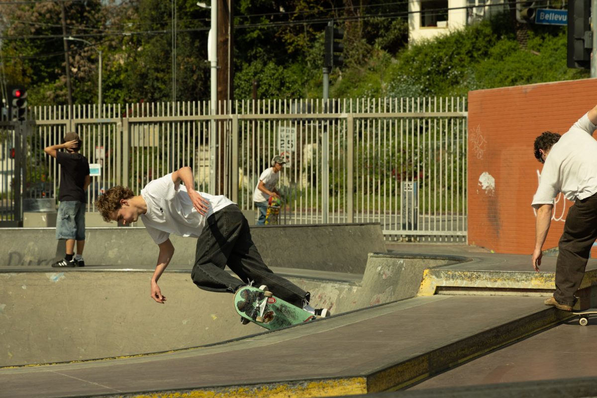 A skater grinds a rail in DTLA.