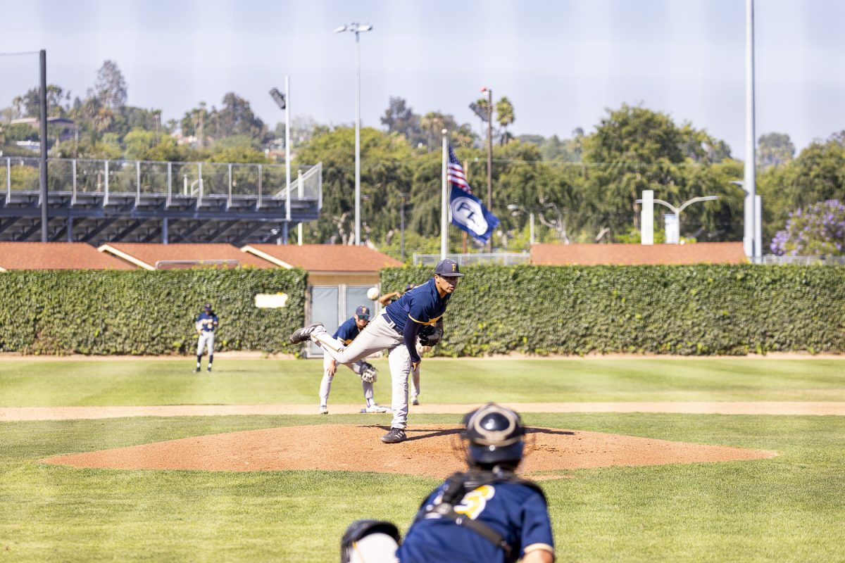 Relief pitcher Eddie Garcia of Fullerton throws a warm up pitch in between innings after entering the game against LA Pierce during Game 2 of the Super Regionals on May 8, 2026, at Hornet Baseball Field in Fullerton, Calif.