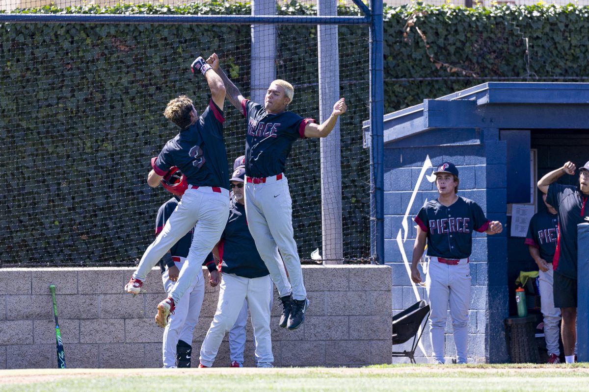 Left Fielder Braden Sellz of LA Pierce leaps into a chest bump celebration with a teammate after hitting a three-run homer in the fourth inning against Fullerton on May 7, 2026, at Hornet Baseball Field in Fullerton, Calif.